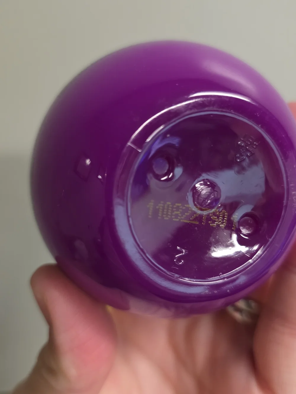 BedHead Small Talk Thickening Cream in Purple with Yellow Pump